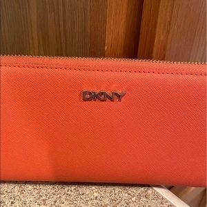 DKNY, orange,  leather zip around wallet. NWOT